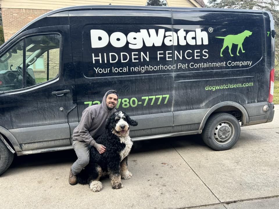 dogwatch sem trainer with dog in front of van